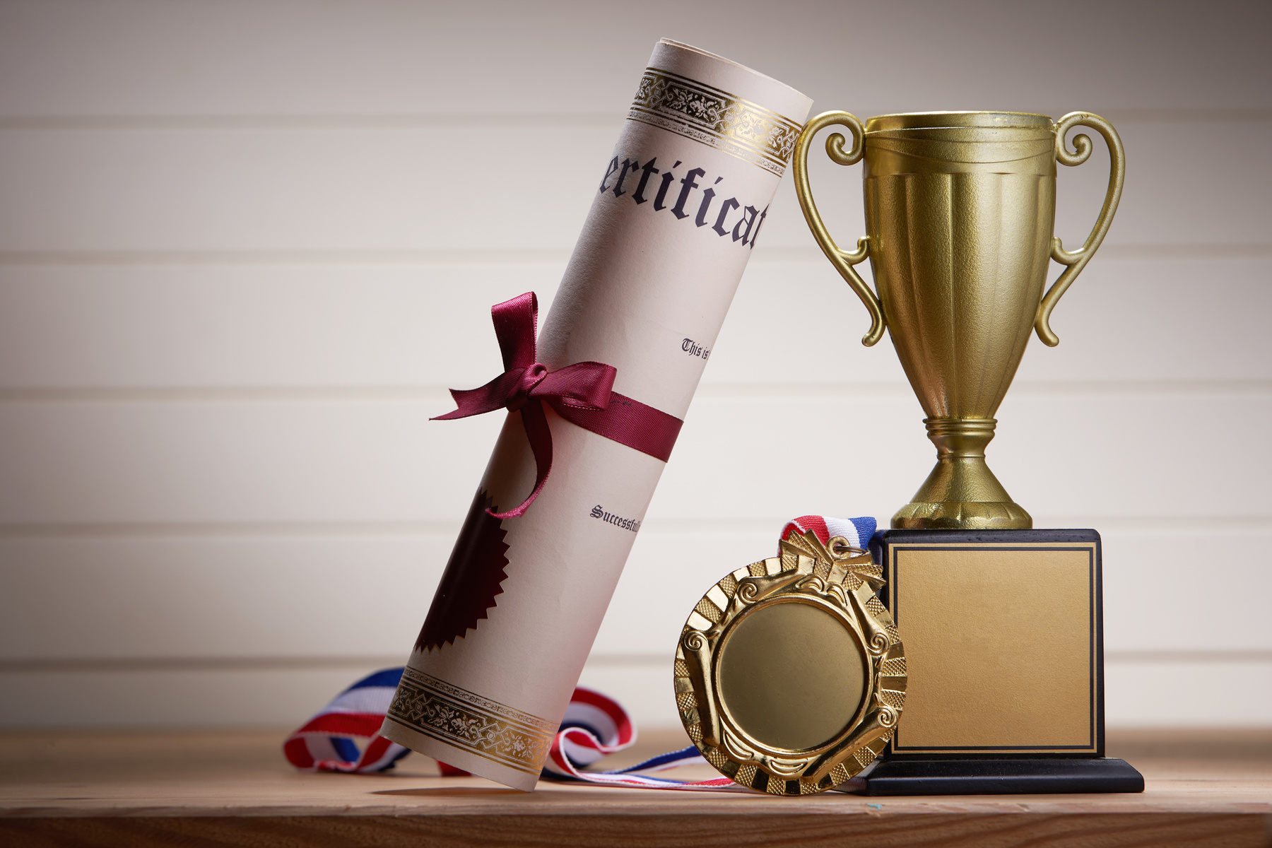 golden trophy and medal with certificate